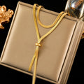 Long adjustable flat-chain necklace with tassel